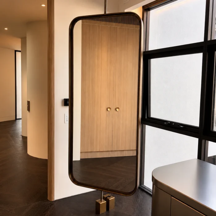 Custom metal cabinet with glass doors in a modern interior