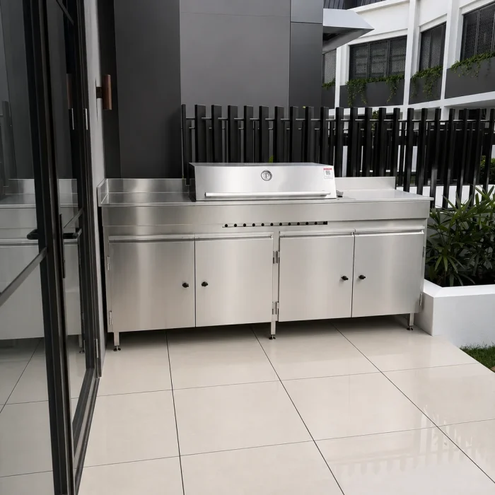 Stainless steel BBQ cabinet in a covered patio area